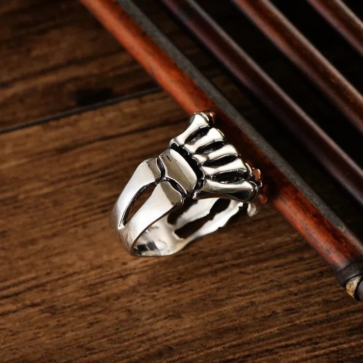 Sterling Silver Skeleton Hand Ring with Rose Gold Skull - Badass Skull Ring. Skull rings for men and women. Badass gifts for badass. Badass birthday gifts. Badass Christmas gifts for badasses. Badass skull accessories. Valentine gifts for him. Anniversary gift for him. Anniversary gift for my badass husband. Badass Birthday gift for my badass boyfriend. Badass Birthday gift for my badass husband.