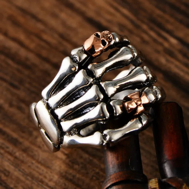 Sterling Silver Skeleton Hand Ring with Rose Gold Skull - Badass Skull Ring. Skull rings for men and women. Badass gifts for badass. Badass birthday gifts. Badass Christmas gifts for badasses. Badass skull accessories. Valentine gifts for him. Anniversary gift for him. Anniversary gift for my badass husband. Badass Birthday gift for my badass boyfriend. Badass Birthday gift for my badass husband.