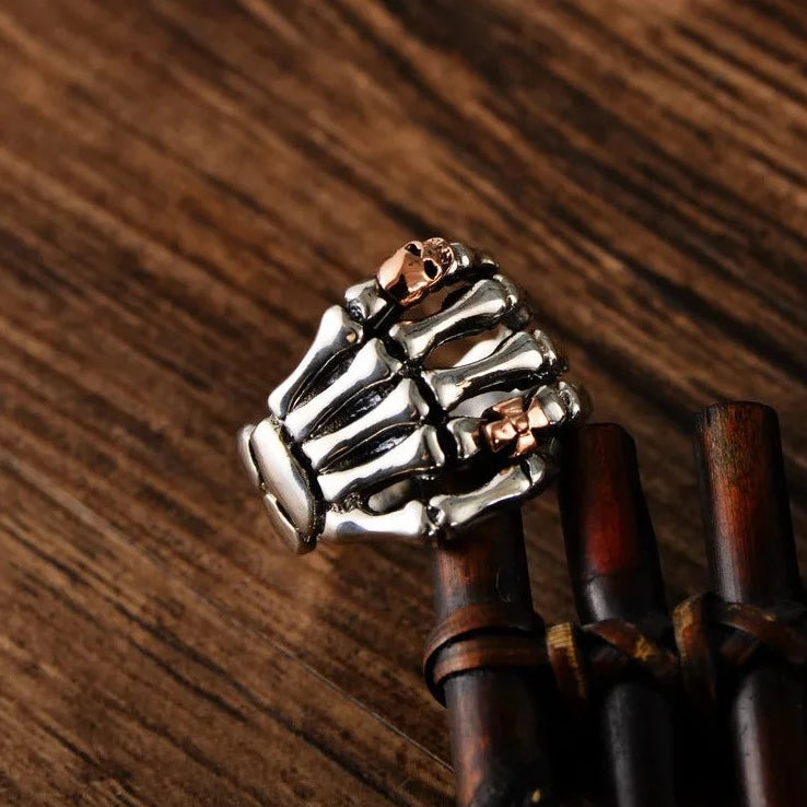 Sterling Silver Skeleton Hand Ring with Rose Gold Skull - Badass Skull Ring. Skull rings for men and women. Badass gifts for badass. Badass birthday gifts. Badass Christmas gifts for badasses. Badass skull accessories. Valentine gifts for him. Anniversary gift for him. Anniversary gift for my badass husband. Badass Birthday gift for my badass boyfriend. Badass Birthday gift for my badass husband.