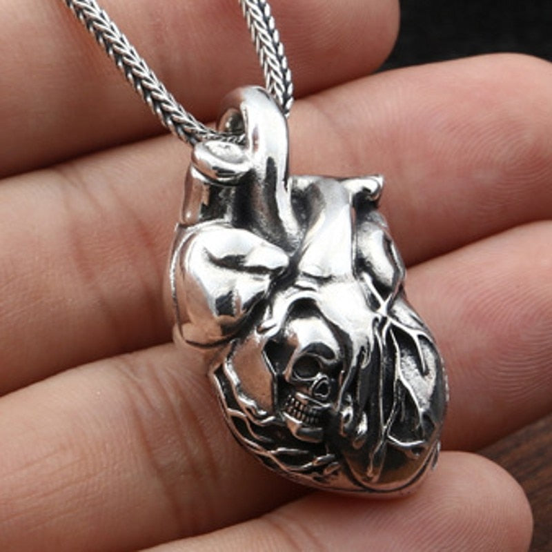 Pure Silver Skull Heart Pendant. Badass skull pendant for men. Badass gifts for badass. Badass birthday gifts. Badass Christmas gifts for badasses. Badass biker skull pendant necklace. Badass sbiker skull jewelry. Badass skull jewelry. Badass skull accessories.