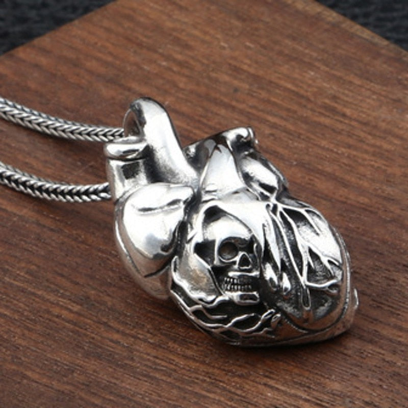 Pure Silver Skull Heart Pendant. Badass skull pendant for men. Badass gifts for badass. Badass birthday gifts. Badass Christmas gifts for badasses. Badass biker skull pendant necklace. Badass sbiker skull jewelry. Badass skull jewelry. Badass skull accessories.