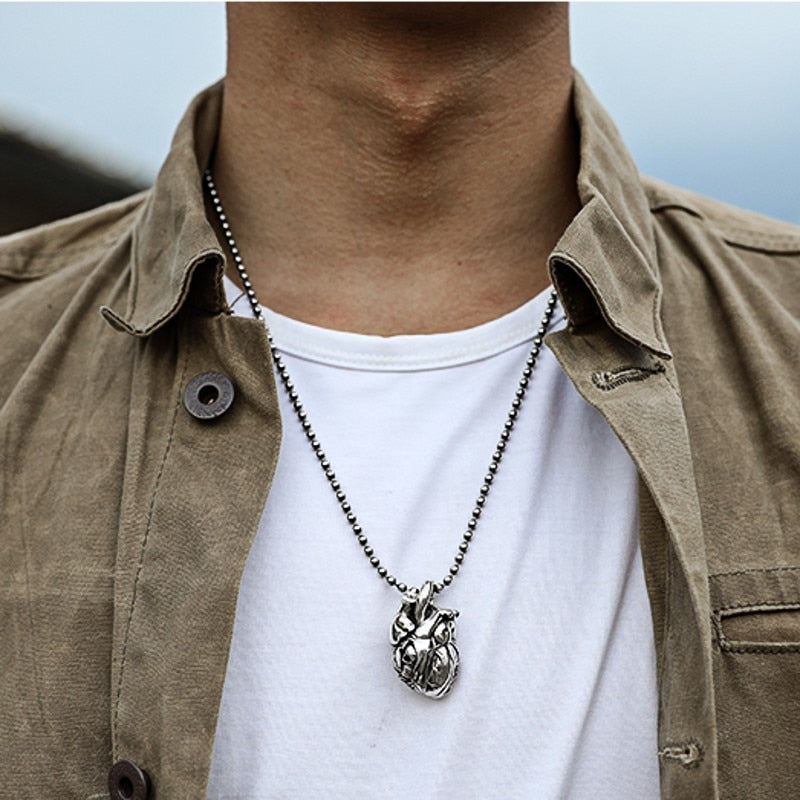 Pure Silver Skull Heart Pendant. Badass skull pendant for men. Badass gifts for badass. Badass birthday gifts. Badass Christmas gifts for badasses. Badass biker skull pendant necklace. Badass sbiker skull jewelry. Badass skull jewelry. Badass skull accessories.
