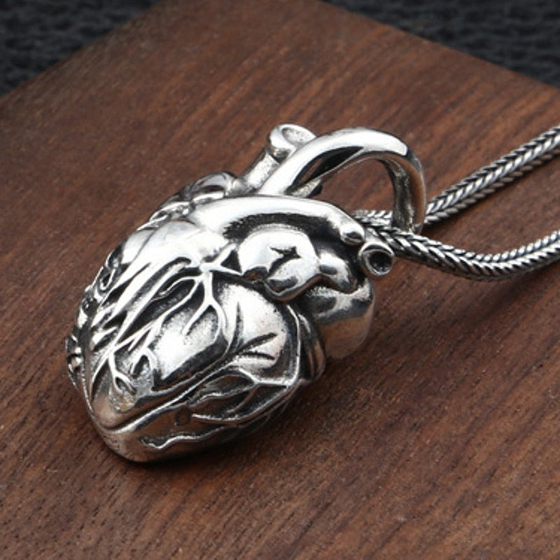 Pure Silver Skull Heart Pendant. Badass skull pendant for men. Badass gifts for badass. Badass birthday gifts. Badass Christmas gifts for badasses. Badass biker skull pendant necklace. Badass sbiker skull jewelry. Badass skull jewelry. Badass skull accessories.