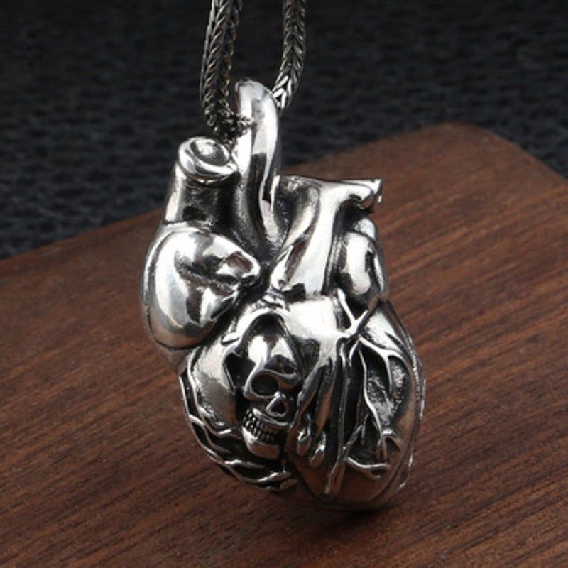 Pure Silver Skull Heart Pendant. Badass skull pendant for men. Badass gifts for badass. Badass birthday gifts. Badass Christmas gifts for badasses. Badass biker skull pendant necklace. Badass sbiker skull jewelry. Badass skull jewelry. Badass skull accessories.