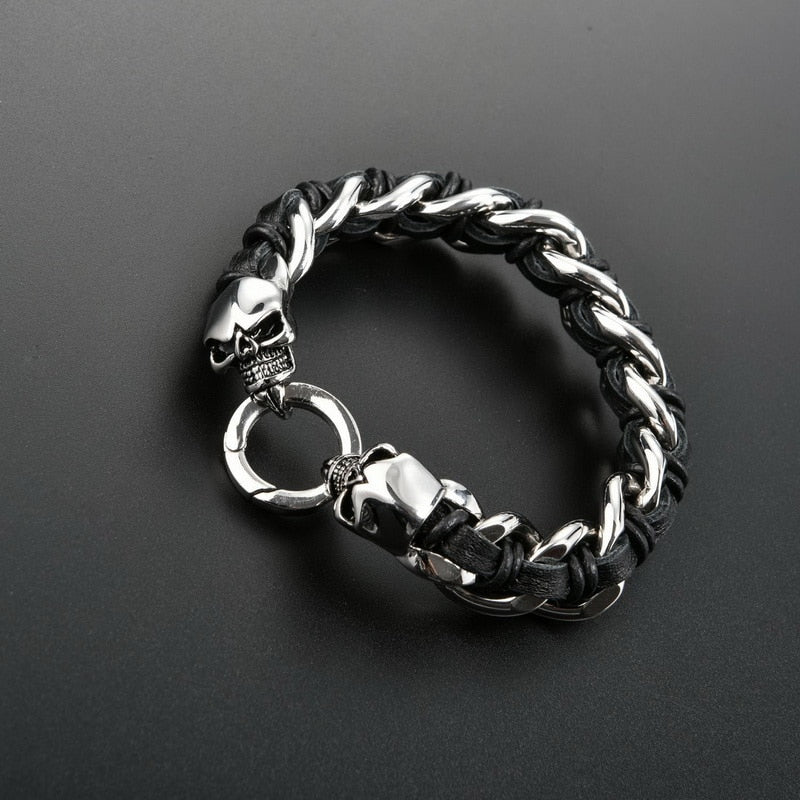 Dual Skull Stainless Steel Bracelet with Woven Cowhide. Badass skull bracelet. Badass biker skull bracelet. Badass skull jewelry. Badass skull accessories.