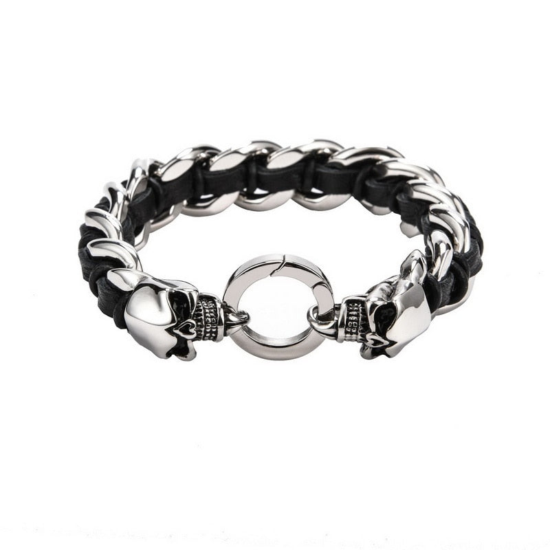 Dual Skull Stainless Steel Bracelet with Woven Cowhide. Badass skull bracelet. Badass biker skull bracelet. Badass skull jewelry. Badass skull accessories.